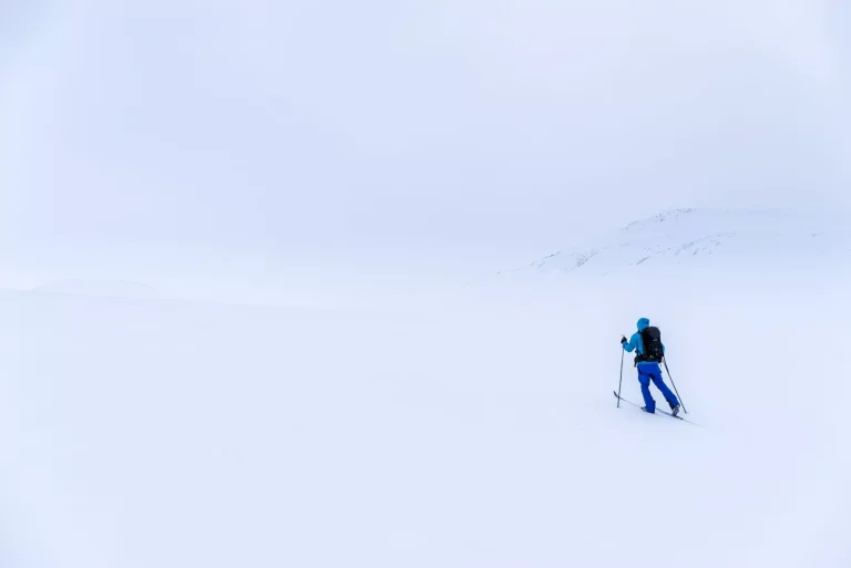Man on cross country skis in the mountains near Hovringen in Rondane National Park, Norway